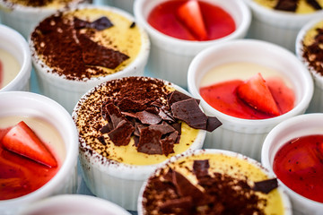 Assorted desserts puffs tarts puddings cakes creme brulee