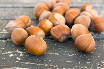 Hazelnuts in shells on the table