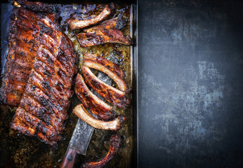Barbecue spare ribs St Louis cut with hot honey chili marinade as top view copy space right and...