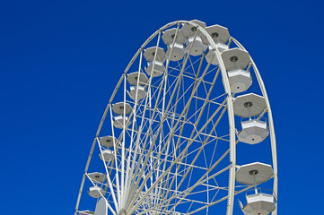 Large white wheel near the port in Antibes
