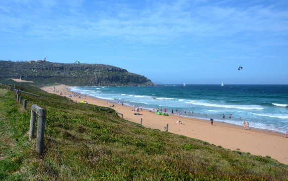 People relaxing at the beach. Palm Beach one of Sydney's iconic northern beaches.