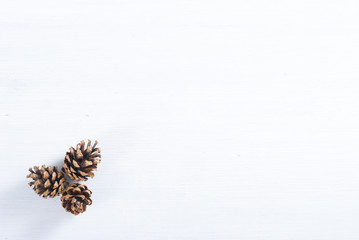 pine cones on white wood table, purity Christmas decoration