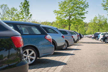 row of cars in parking lot
