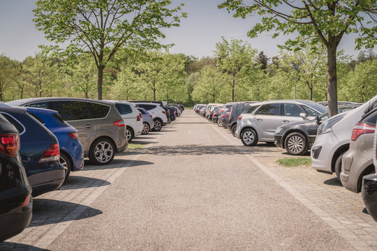 row of cars in parking lot