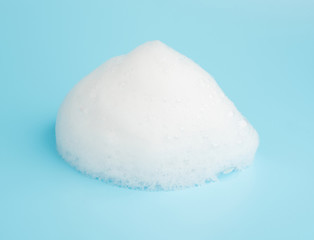 Soap foam bubble isolated on blue background object beatuy health care concept