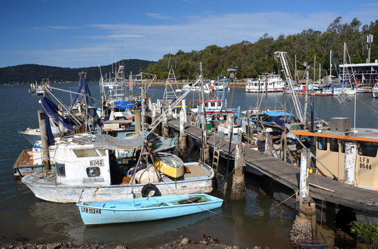 Old dingy Fisher boats at the marina at Hawkesbury River in Brooklyn (NSW, Australia) on a sunny day.