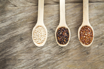 Seeds of white, red and black quinoa - Chenopodium quinoa. Top view