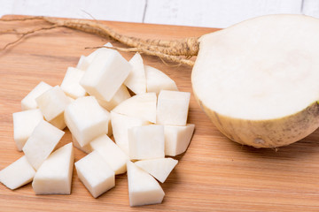 Tasty and useful turnip on wooden background