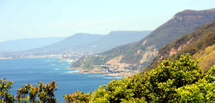 Panoramic view from Otford Lookout. The Sea Cliff Bridge is a balanced cantilever bridge.