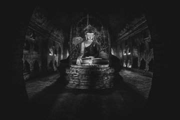 Buddha statue inside old pagoda at Bagan, Myanmar.