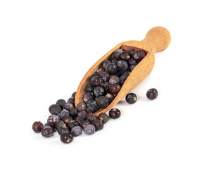 Dried juniper berries in wooden spoon isolated on white