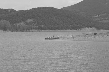 "Salvataggio" boat (means Rescue boat) isolated in the lake - Fiastra Lake, Marche, Italy