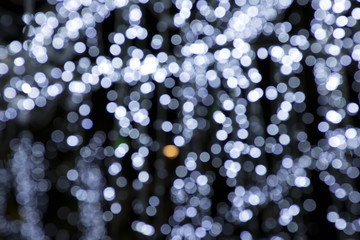 Blurry background image of defocused abstract lights at night