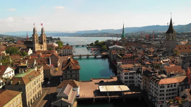 Drone dollyshot over the river Limmat in Zurich, Switzerland on a peaceful, warm and sunny summer evening
