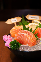 Premium Japanese Salmon Sashimi, Chutoro, on ice in bowl.