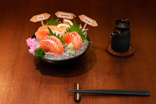 Premium Japanese Salmon Sashimi, Chutoro, on ice in bowl.