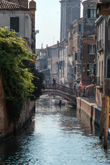 Venice, Italy - September 15, 2018 - Tourists walking along the canals of Venice