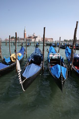 Obraz na płótnie Canvas Gondola on canal in Venice, buildings in background Italy