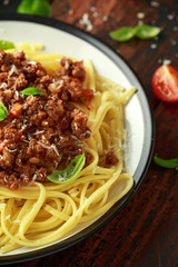 Italian pasta bolognese with beef, basil and parmesan cheese
