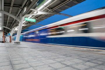 Motion blurred train arriving at the platform
