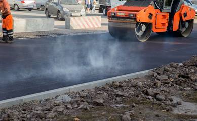 Works road roller with asphalt