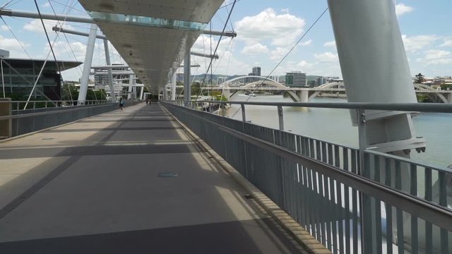 Walking on Kurilpa bridge in Brisbane in the summer, Australia