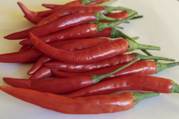 Red chili peppers on white background.