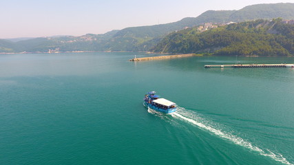 Fototapeta premium Aerial view of Pursuit Of A Sail Boat