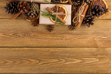 Gifts and fir branches form a frame. Concept blank for a Christmas card. Copy space, top view.