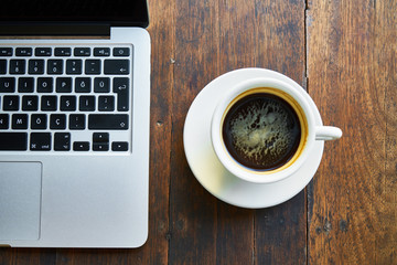 Office Desk with Laptop and Coffee Cup