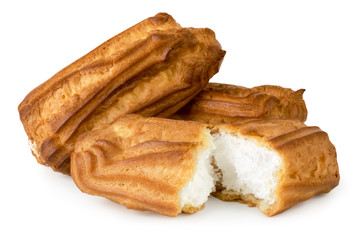 Eclairs with cream and broken in half on a white, isolated.