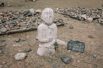 Ancient gravestones in the steppes of the Mongolia. Mongolian Cemetery