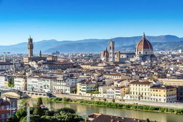Fototapeta premium Panoramic view of Florence, Italy viewed from Piazzale Michelangelo before sunset with the view of Arno river.