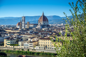 Fototapeta premium Panoramic view of Florence, Italy before sunset with the view of Arno river and the famous Cathedral Santa Maria del Fiore and the Duomo.