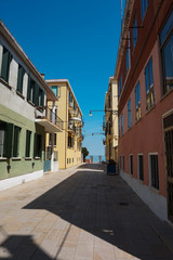 Fototapeta na wymiar Exploring a charming and calm backstreet on Murano island.