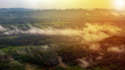 mountains landscape under morning sky with fog