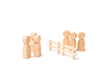 A wooden fence divides the two groups discussing the case. Termination and breakdown of relations, breaking ties. Contract break, conflict of interests. Negotiations of businessmen.