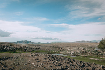 landscape with mountains, forest and a river in front. beautiful scenery