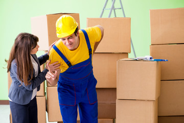 Woman boss and man contractor working with boxes delivery