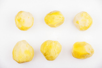 six cleaned potato studio white background 
