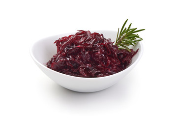 Bowl full with grated beets with herbs. Isolated on a white background