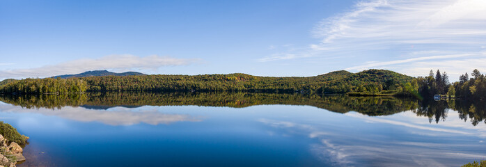 Mirror effect lake during fall in Mount Tremblant, Quebec, Canada