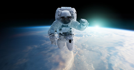 Fototapeta premium Astronauta unoszący się w przestrzeni Elementy renderowania 3D tego obrazu dostarczone przez NASA
