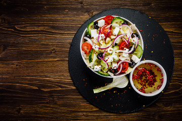 Greek salad on wooden background