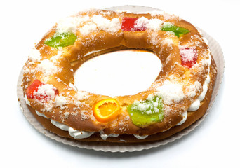 Roscon de reyes, typical Spanish dessert of Epiphany, isolated on white background