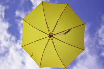 colorful umbrella on background of blue sky