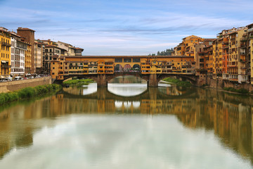 Fototapeta na wymiar Ponte Vecchio bridge across Arno river in Florence, Italy
