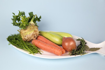 Healthy food vegetables on a plate isolated blue background