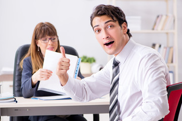 Man and woman discussing in office