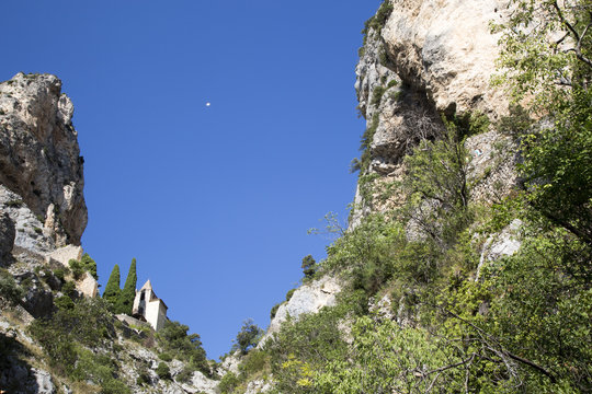 The tenth century village of Moustiers-Sainte-Marie in the Alpes-de-Haute-Provence. With the Etoile de Moustiers and the chapel Notre-Dame-de-Beauvoir
